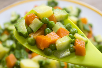 chopped vegetables on a spatula