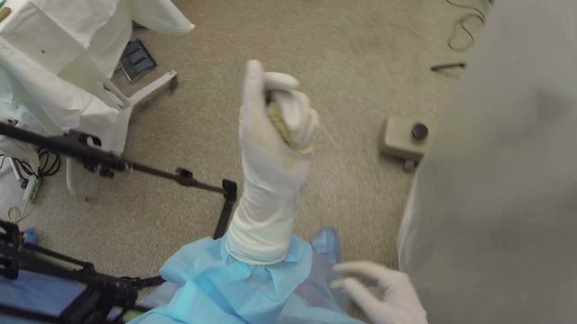 Subjective camera on nurse's head during the surgery, where she walks and takes some surgical instruments (1080p, 25fps)