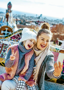 mother and daughter travellers taking selfie at Guell Park