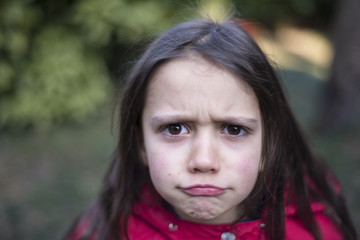 portrait of a little girl of 7 years on the outside