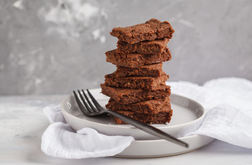 A stack of slices of healthy vegan brownie. Healthy dietary vegan dessert concept. Copy space