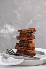 A stack of slices of healthy vegan brownies. Healthy dietary vegan dessert concept. Copy space