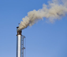 Industrial chimney with smoke