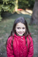 portrait of a little girl of 7 years on the outside