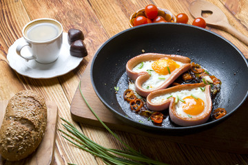 Eggs in the shape of a heart on wood