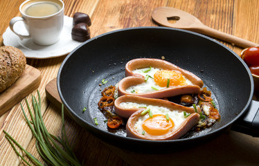 Eggs in the shape of a heart on wood