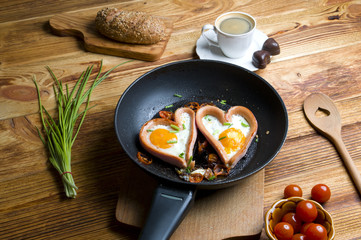Eggs in the shape of a heart on wood