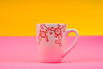 Single mug on a pink yellow color background