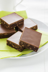 Tiffin or fridge cake a confection made with cocoa crushed biscuit dried fruit and melted chocolate then chilled