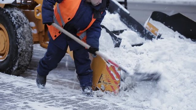 Removing snow with plow. Close up of iron snowplow pushing a lot of snow away.