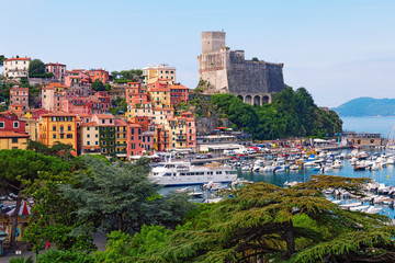 Fototapeta na wymiar Top view of town Lerici on Ligurian coast of Italy, Europe. Castle of Lerici and port of Lerici. Beautiful colorful cityscape traditional Italian architecture