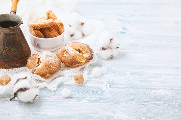 tender cupcake, cookies in a bowl on a white wooden background, with pistachios. Space for text