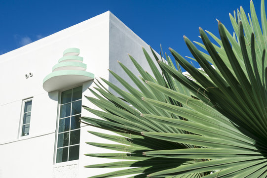 Detail Of Classic Art Deco Architecture With Palm Fronds And Blue Sky In South Beach, Miami, Florida