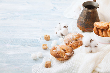 tender cupcake, cookies in a bowl on a white wooden background, with pistachios. Space for text