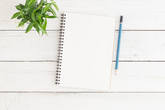 Empty Open Notebook On White Wood Table Top View