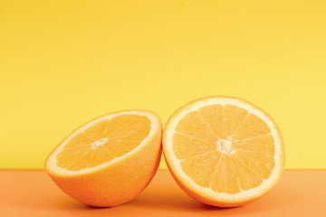 Orange slice isolated on orange background.