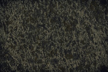 Granite rock closeup background, stone texture, cracked surface