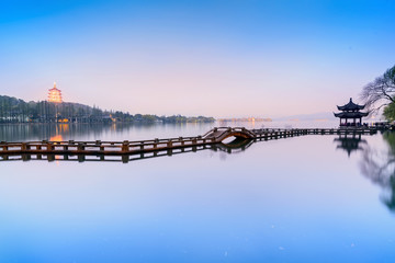 Fototapeta premium Landscape of West Lake. Long Bridge and Leifeng Pagoda. Located in Hangzhou, Jiangsu, China.