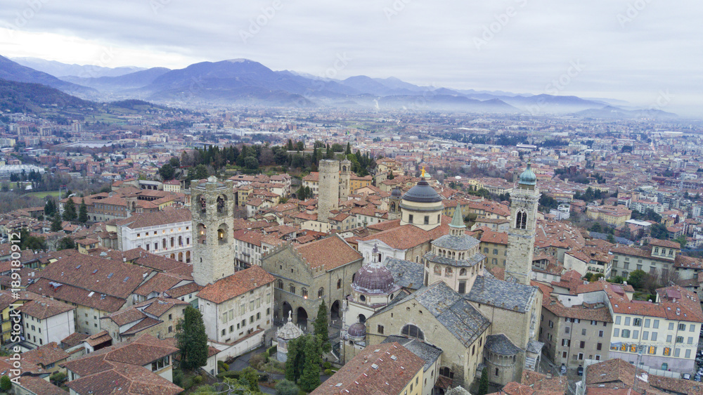 Wall mural aerial video shooting with drone on bergamo, famous and ancient lombardia city, founded on the hills