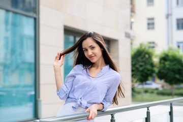 Girl with beautiful hair on the street.