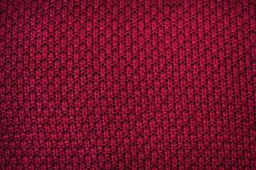 Red fabric. Knitting. Background of fabric. Close-up. Texture