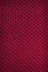 Red fabric. Knitting. Background of fabric. Close-up. Texture