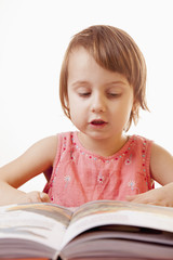 little baby girl reading a book (development, education)