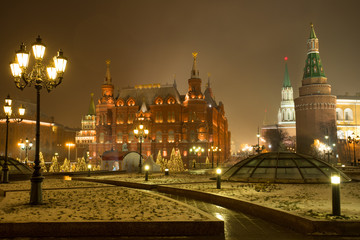 Fototapeta na wymiar Moscow, Russia. State Historical Museum And Moscow Kremlin On Manege Square With Light Lamps In Evening Time Winter.