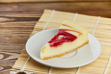 delicious cheesecake with strawberries on  plate