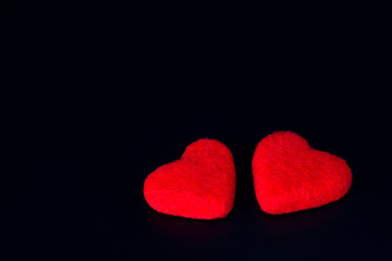 Two red hearts together