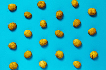 Walnut Shell On Blue Surface, Flat lay. Creative Concept