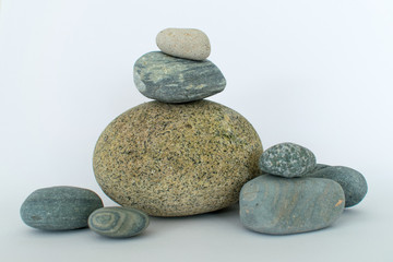 Rocks of many different colors and sizes on white