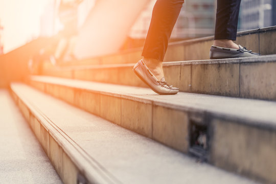 Moving Up Stair With Woman Legs With Casual Shoes View From Below With Free Copyspace