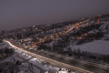 Fototapeta premium night city view with transport interchange, lights and traffic 