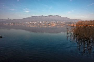 Panoramic view from the Varese lake with the Campo dei Fiori mountain in the background.