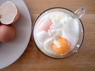 Soft boiled eggs in a cup. Concept of protein diet.
