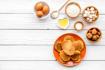 Ingredients for cook american pancakes on white wooden background top view copy space