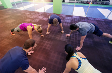 group of people exercising in gym