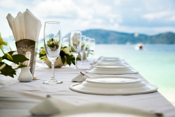 Table setting for an event party or wedding reception at the beach