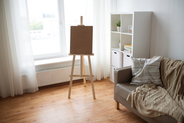 Fototapeta na wymiar wooden easel at home room or art studio
