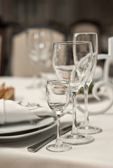 Glass dishes on a table on a white tablecloth