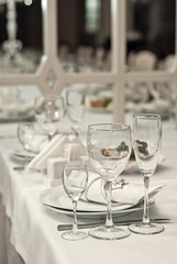 Glass dishes on a table on a white tablecloth