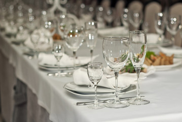 Glass dishes on a table on a white tablecloth