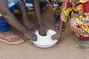 Close-Up Shot of Young African Boys and Girls Eating Outdoors