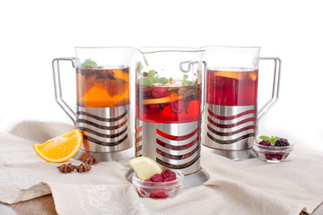 Composition of tea with citrus and berry taste on a white background