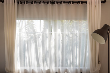 White curtain and windows.