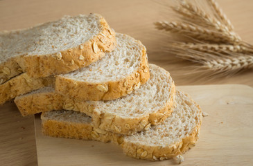 Whole wheat breads on cutting board,still life.