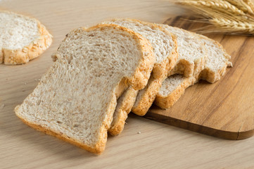 Whole wheat breads on cutting board,still life.