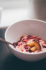 Porridge with fresh plums and plum jam 