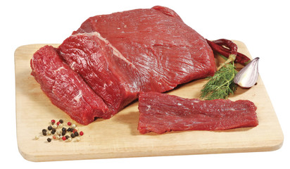 fresh raw red beef meat big steak chunk on wooden cut board isolated over white background
